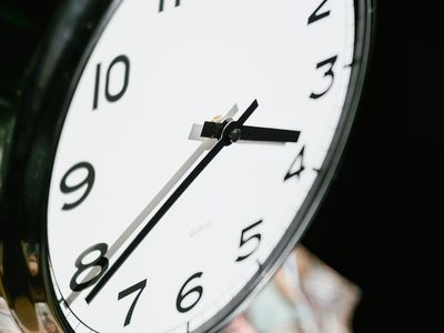 Minimalist clock face showing precise time movement.